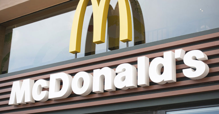 Fast Food Diners Spark Debate After Letting Pet Dog Sit on Table at a McDonald’s - Featured image