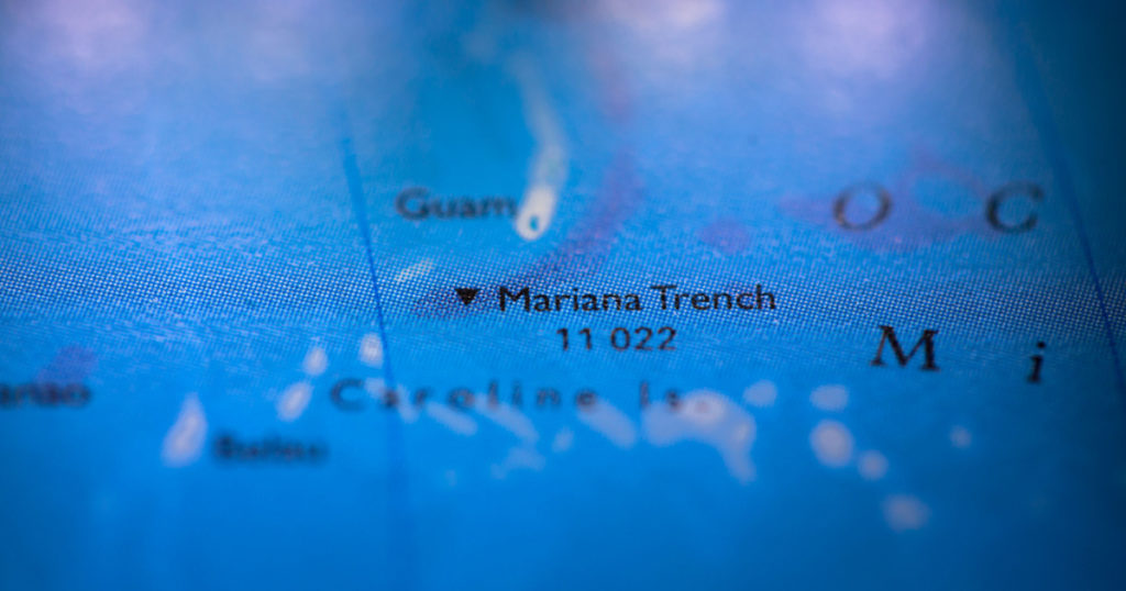Geographical map location of Mariana Trench off coast of Philippines Pacific Ocean on atlas
