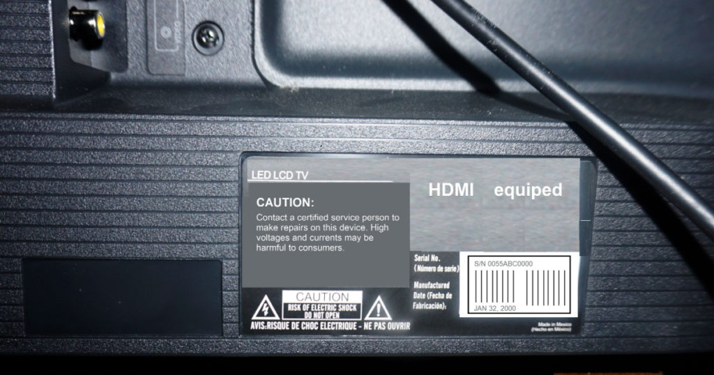 back of a tv showing where the serial number is located and any cautionary statements mandated by the government.
