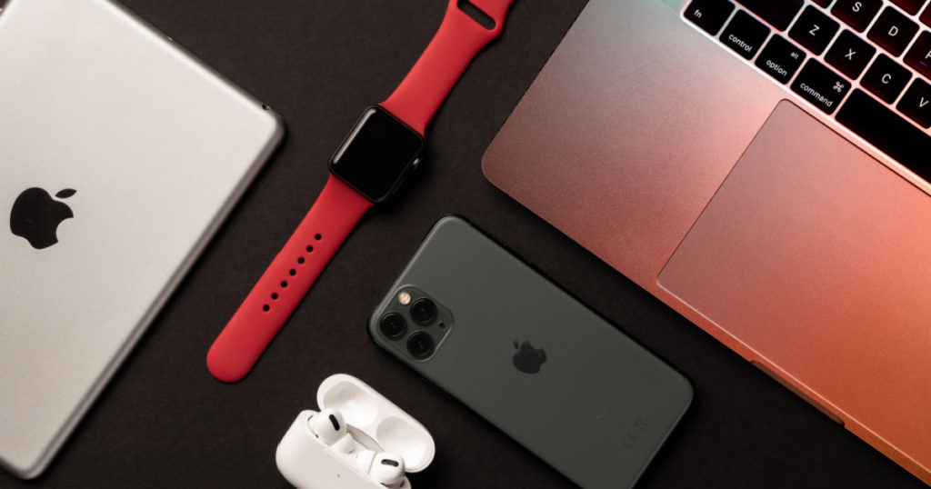 Lahore, Pakistan - May 13th, 2021: Flat Lay of different apple products on a grey background.
