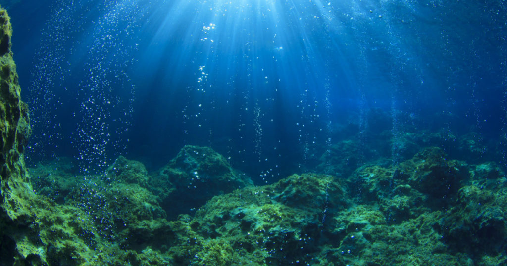 Underwater ocean scene with air bubbles, unfocused
