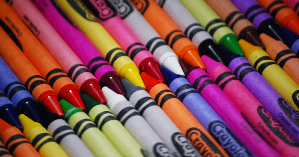 Crayons closeup photo many random colors together
