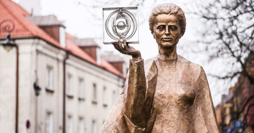 WARSAW, POLAND - JANUARY 2, 2015: Sculpture of Marie Sklodowska-Curie by polish sculptor Bronislaw Krzysztof. The Nobel prize winning scientist is holding a graphic symbol of Polonium in her hand.
