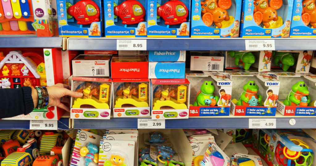 WOLVEGA, THE NETHERLANDS - DECEMBER 2, 2016: Toys from different brands in a toy store. Aisle with a variety of Toys in a Dutch Action Superstore.
