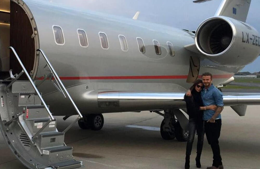David and Victoria Beckham with their private Jet