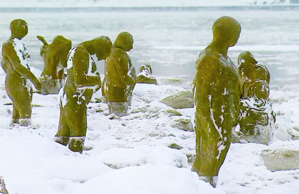 Eerie Figures Along Alaska's Shore: Art Installation by Sarah Davies