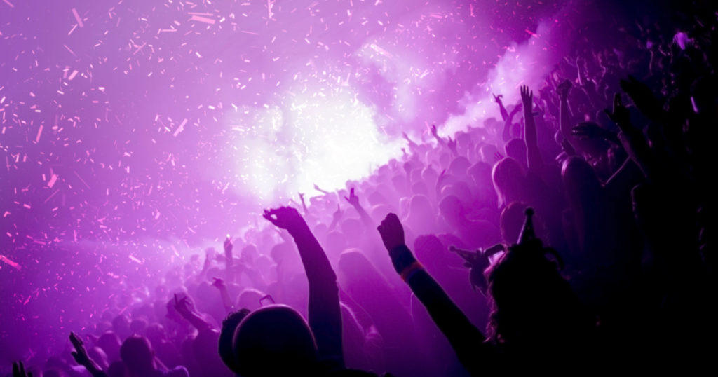 Party goers in a nightclub with co2 cannons firing
