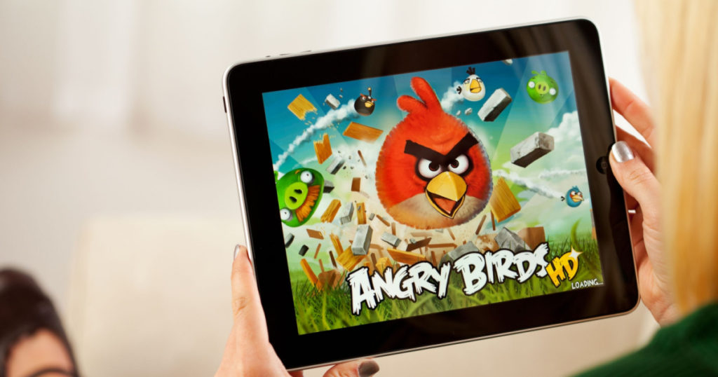 St. Louis, Missouri, USA - March 9, 2011: Woman Playing Angry Birds Video Game On Apple iPad 1
