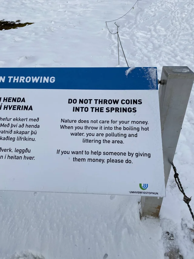 Warning to not throw coins into the geyser