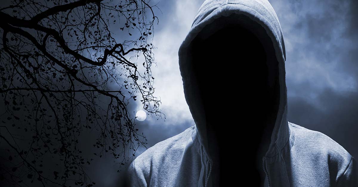 hooded person ar night, cannot see face