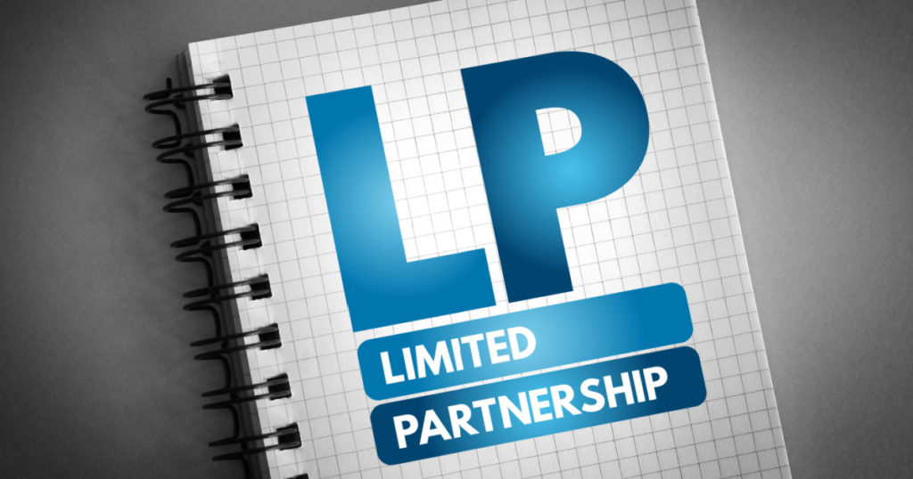 LP Limited Partnership - exists when two or more partners go into business together, acronym business concept on notepad
