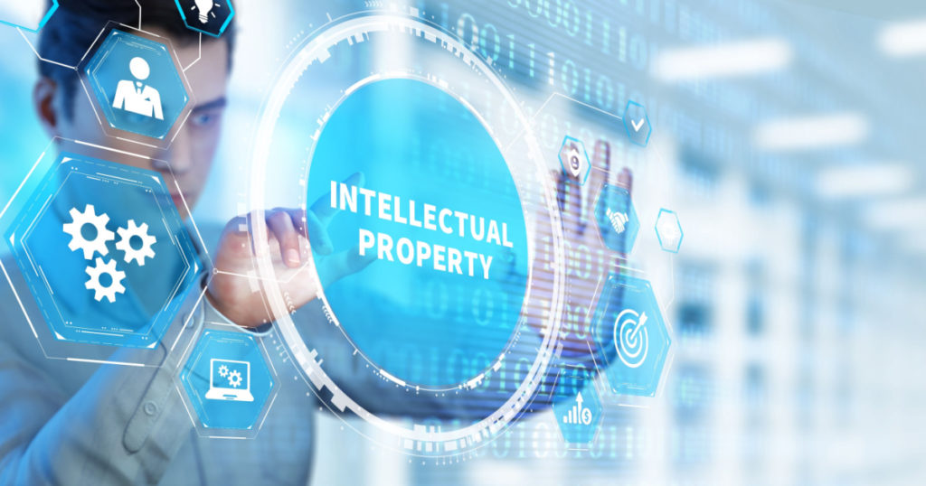 Business, technology, internet and network concept. Virtual screen of the future and sees the inscription: Intellectual property.

