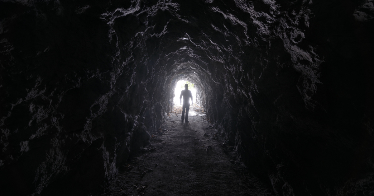 Man explores a cave