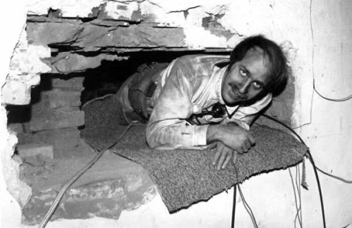 historical photos - a Technical Security Officer from the US Diplomatic Security Service emerges from a tunnel