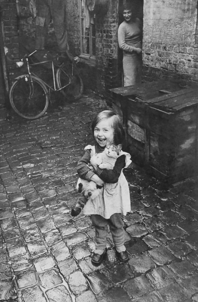 the joy of a French girl, radiating happiness alongside her feline companion