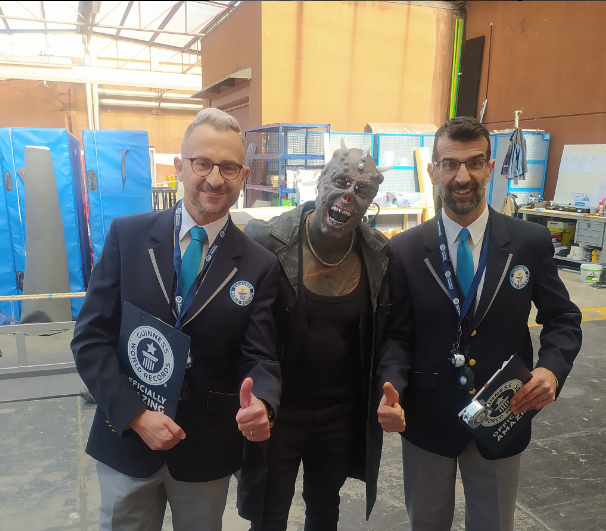 Michel, with the Guinness Officials, after being awarded the horn implant record.