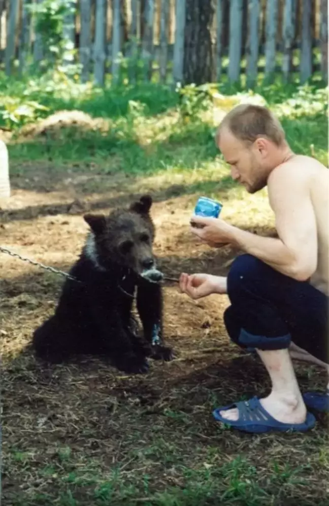 Sergey Grigoriyev, with a bear cub. 
