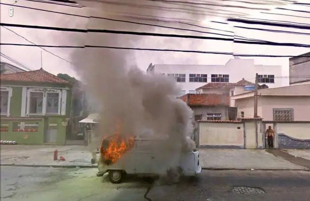 A flaming van and a shirtless man calmly watching. Is it a crime scene or just a strange coincidence? Another mystery captured by Google Street View.