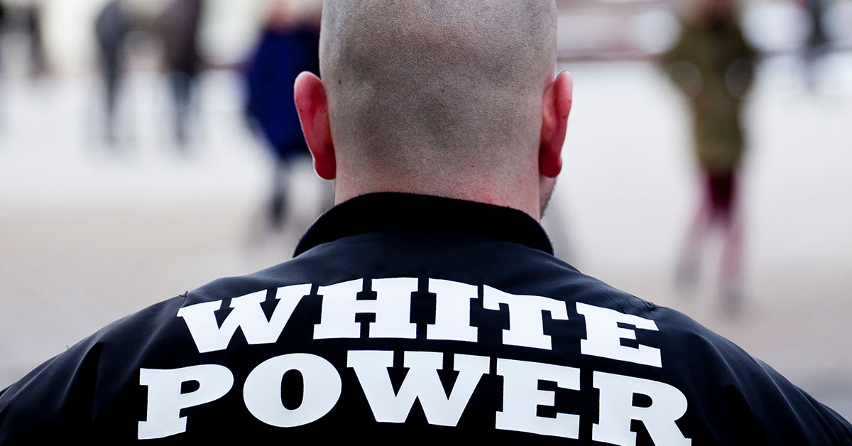 Skinhead with "White Power" written on back of his jacket