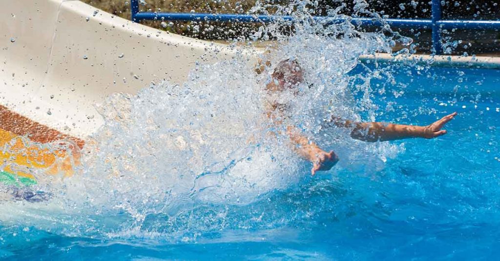 World Champion Diver Defiantly Ignores ‘No Women’ Sign on Waterslide, Goes Down Anyways - Featured image