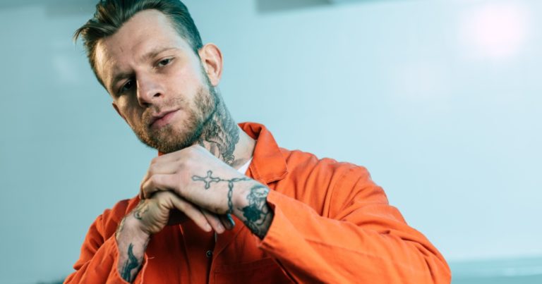 15 Prison Tattoos and Their Meanings - Featured image